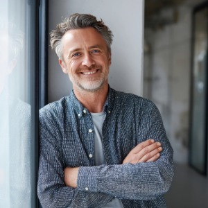 Relaxed business owner - HR and payroll outsourced to Exceed